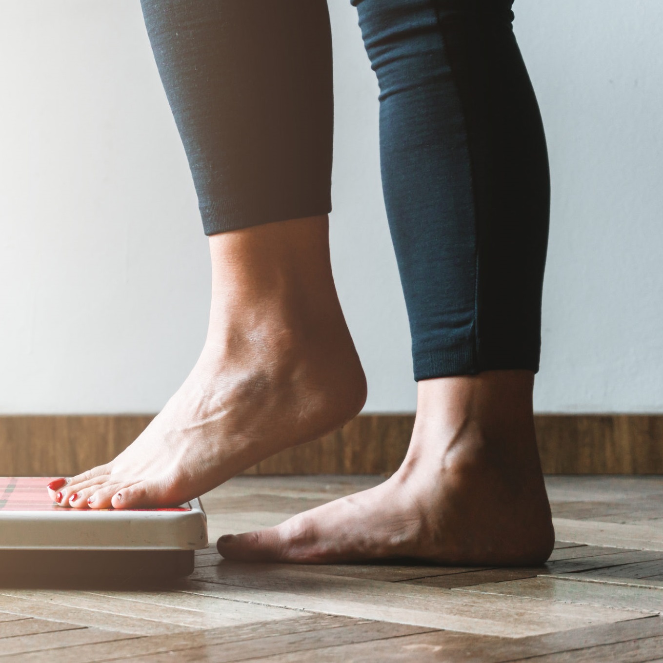 Person stepping onto scale