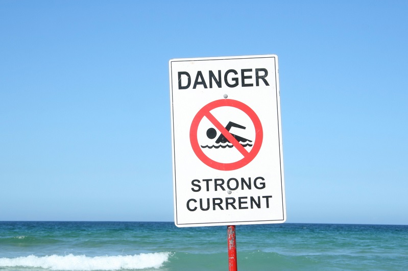 Warning Sign "Danger Strong Current" at the beach.