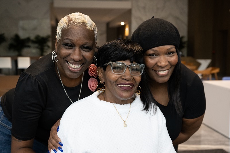 Diane Pratt and her family smiling together. 