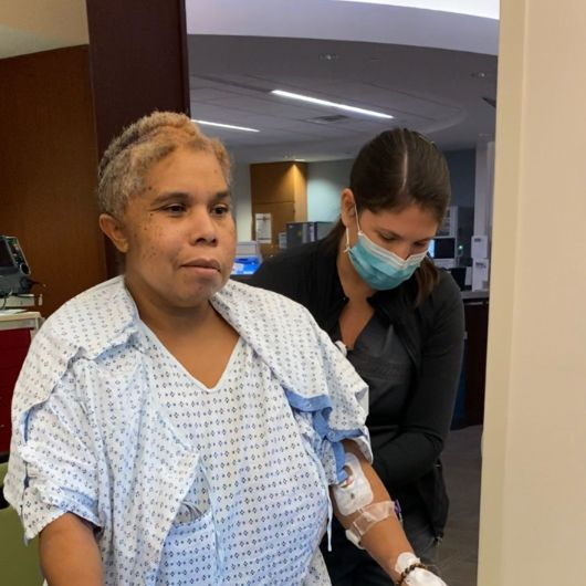 Aretha walking in the hospital during her recovery.