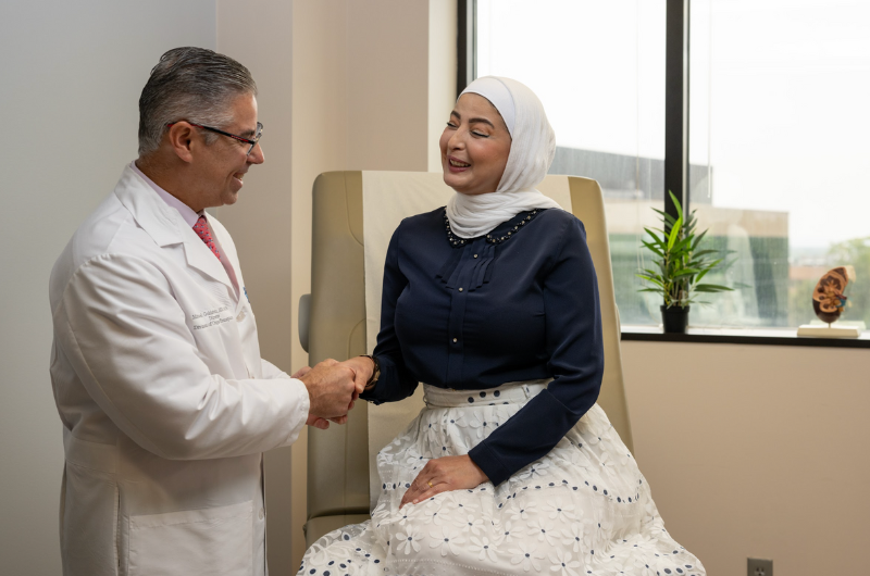 46-year-old Rania Targali shakes hands with her doctor, Michael J. Goldstein, M.D., FACS.