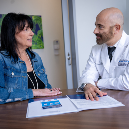Physician talking with a female patient.