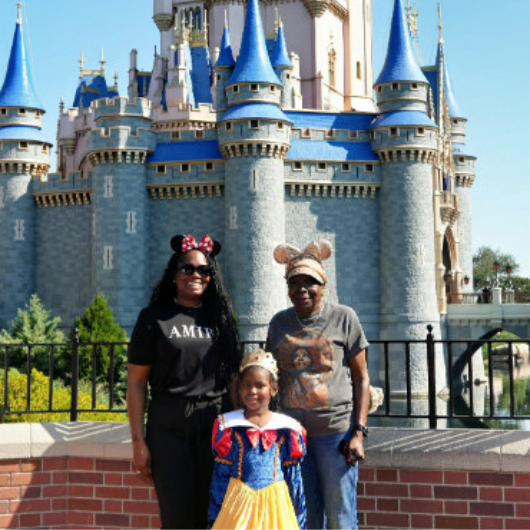 Curlean Phillips poses with her daughter and granddaughter at Disney.