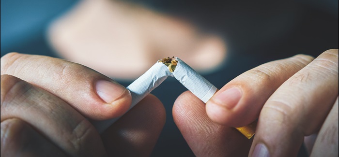 Hands Cracking Cigarette