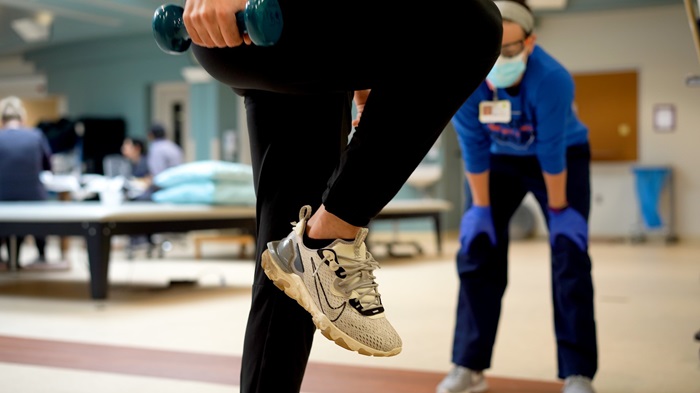 Person exercising in rehab setting