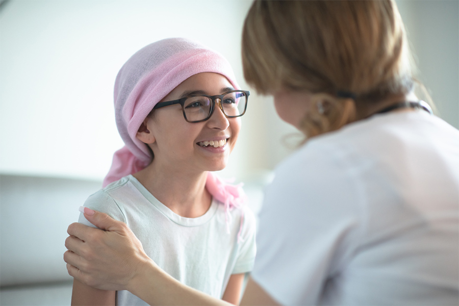 child patient smiling with doctor