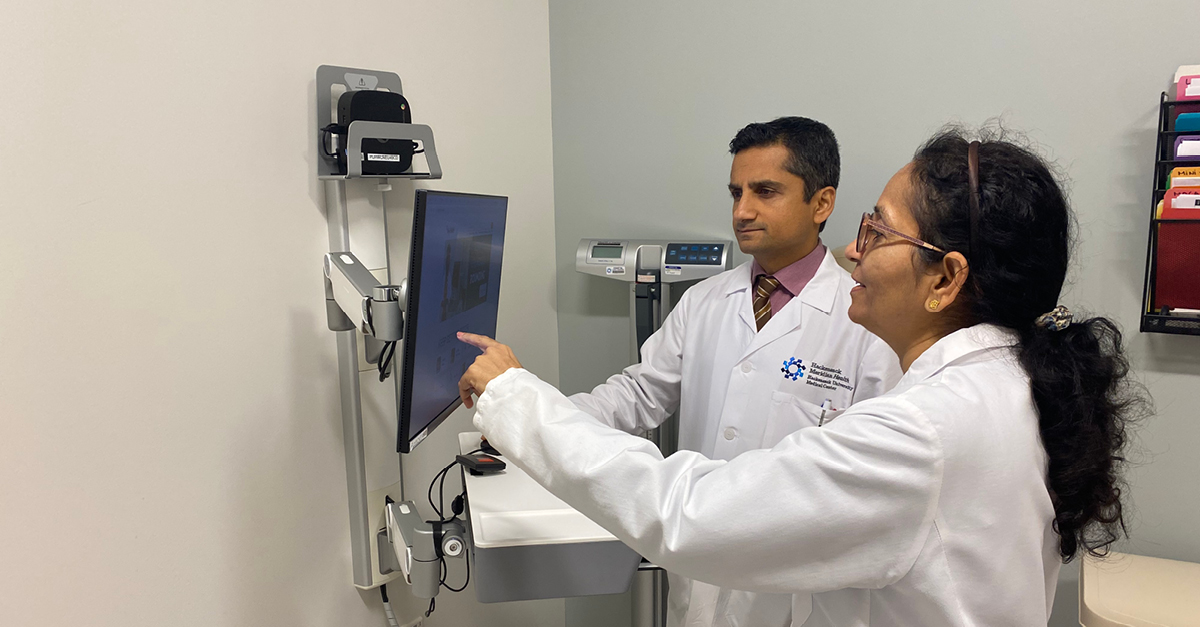 Two Doctors Looking at Computer