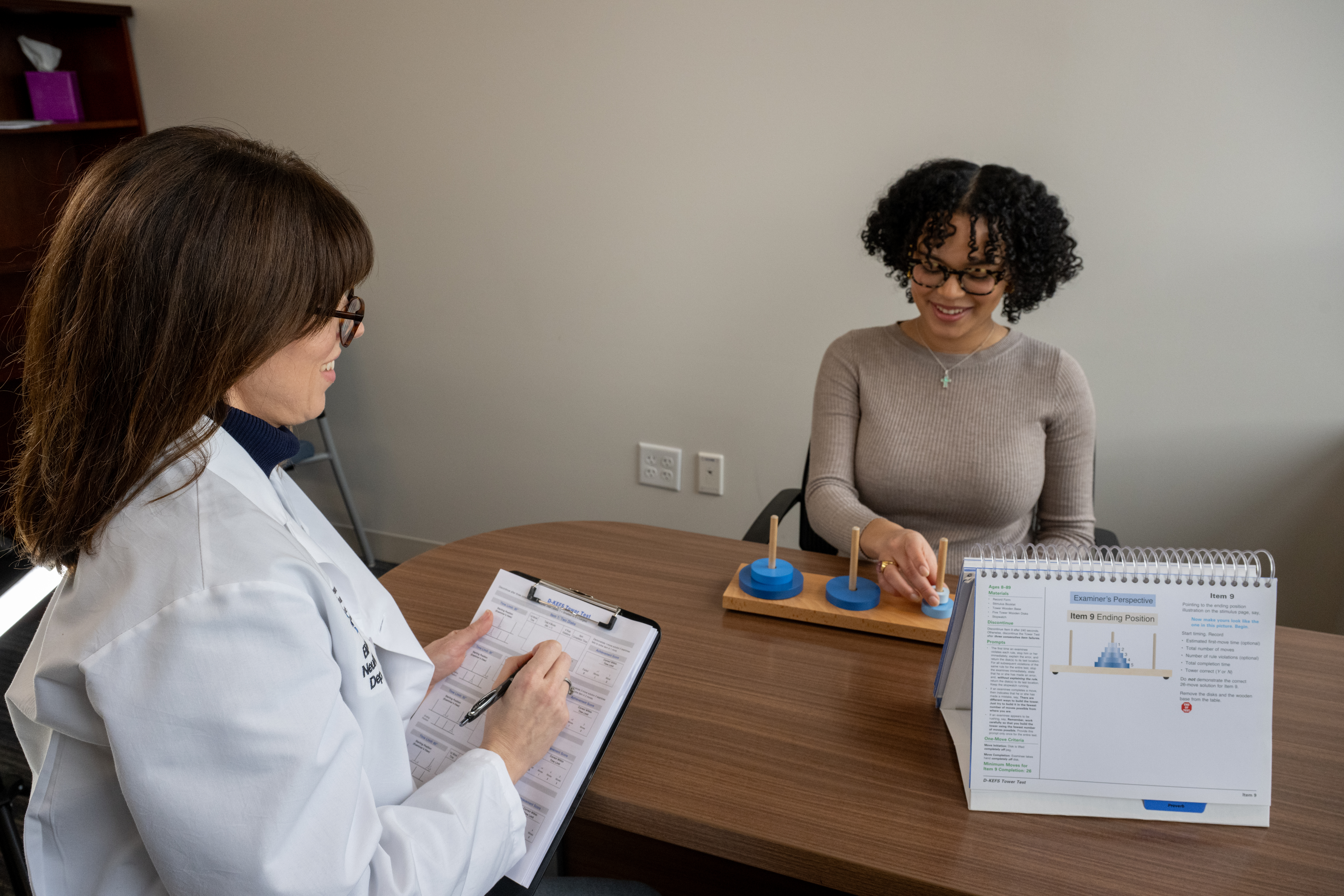 woman taking assessment with neuro doctor