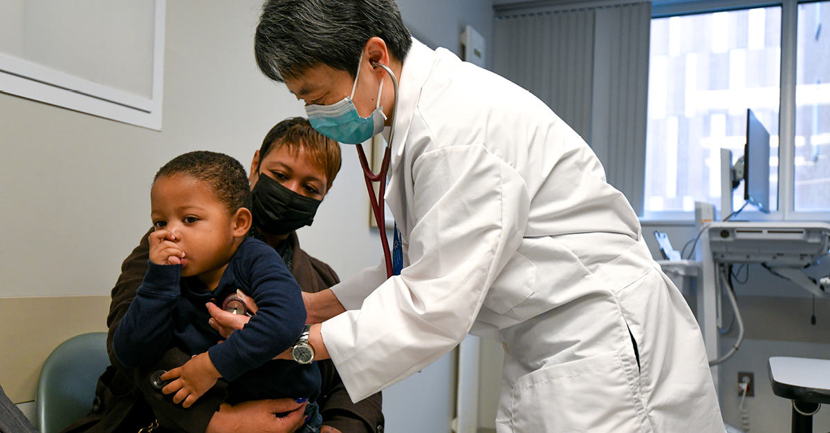 Pediatric Physician with child patient