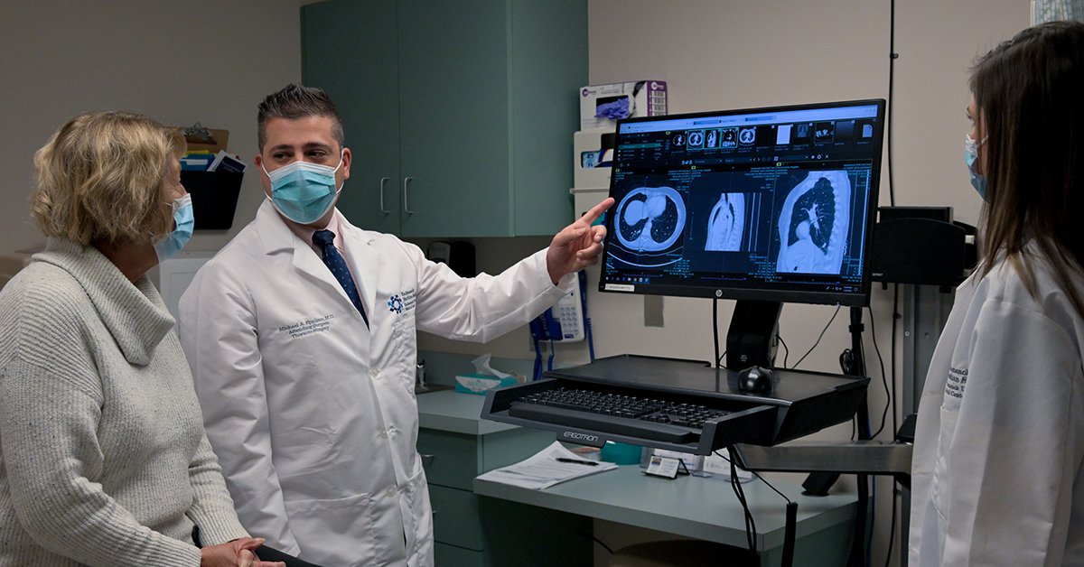 Physician reviewing scans with patient