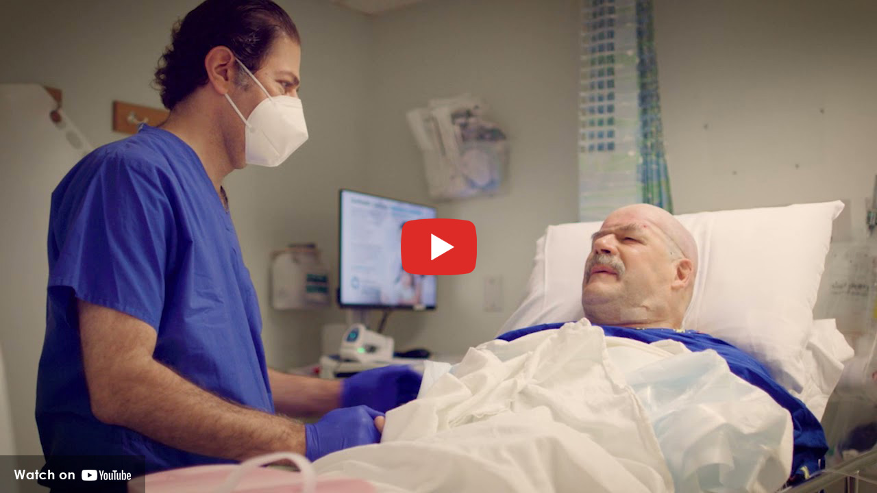 Patient in hospital bed with medical professional