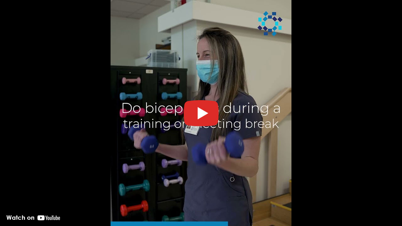 person wearing mask standing up wearing hospital gown