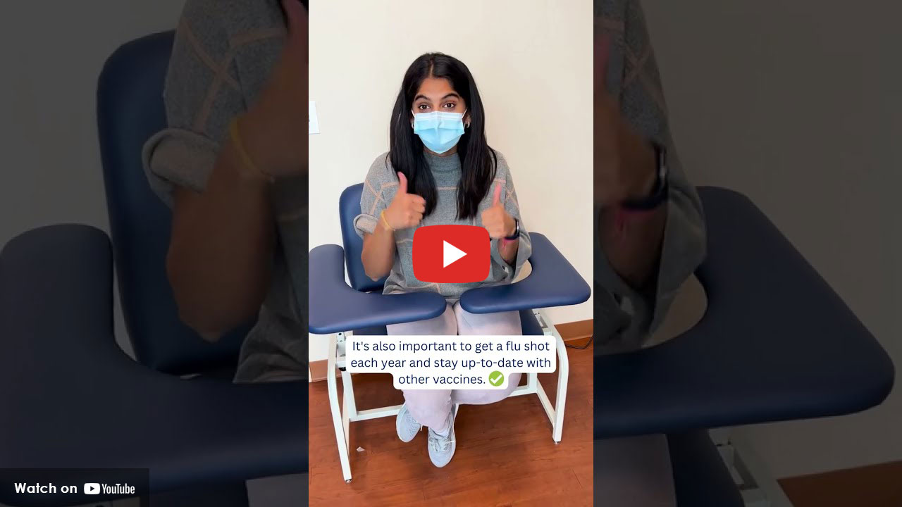 Woman wearing mask after receiving flu shot at clinic